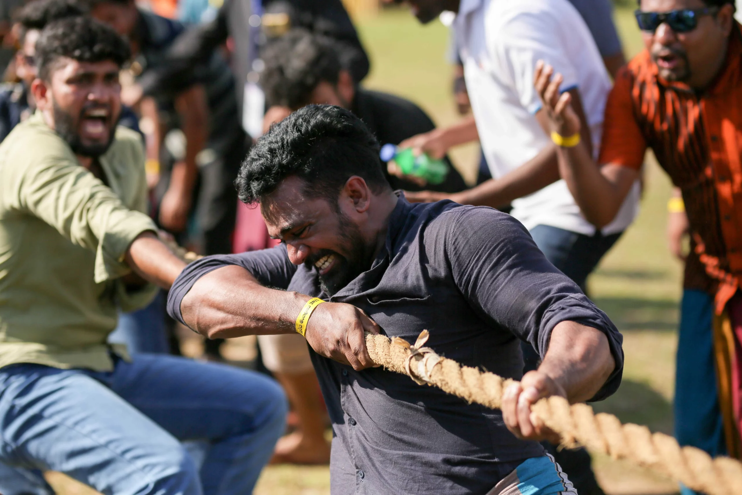 A tug of war game played and few other participants are encouring the players
