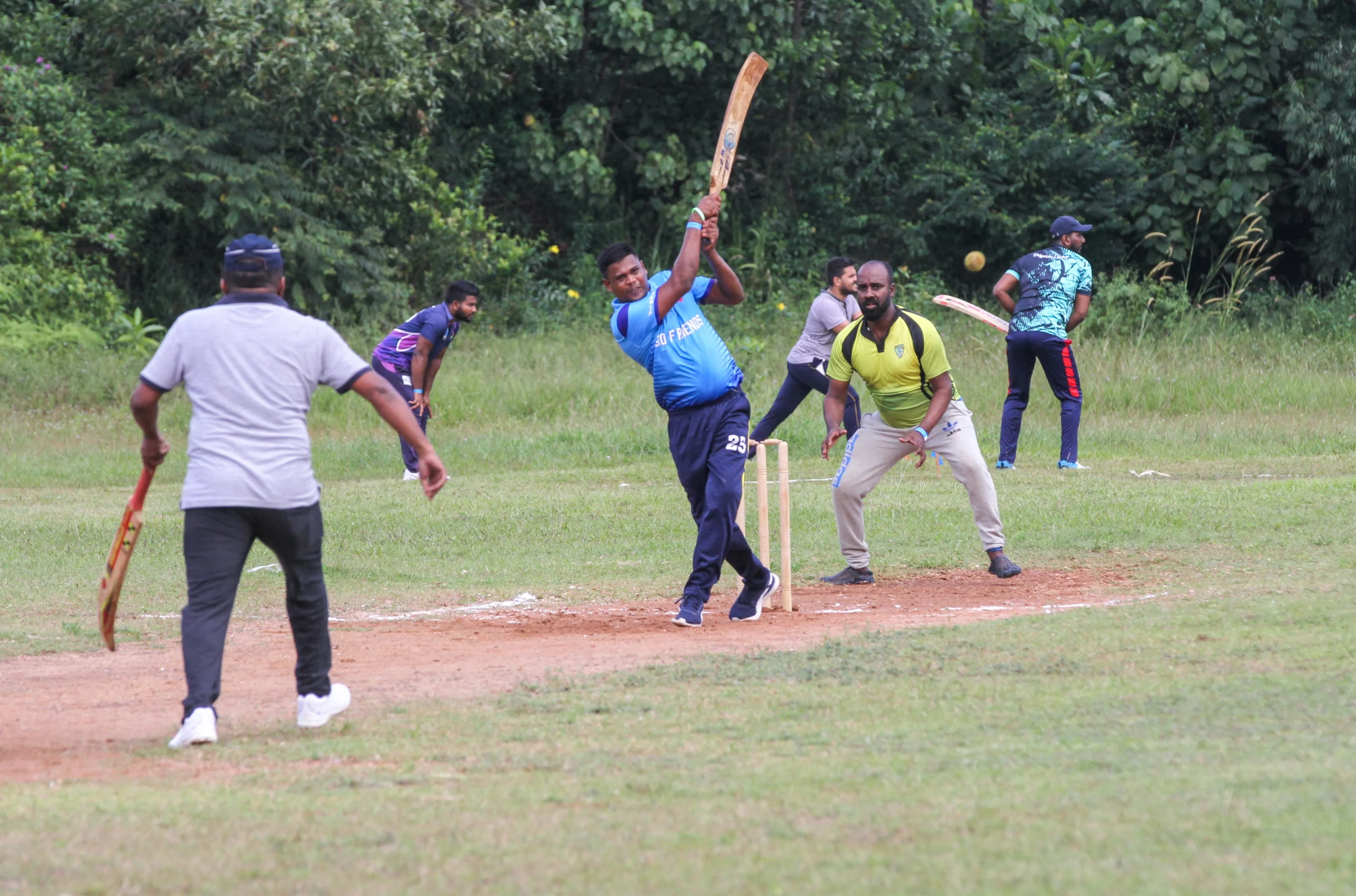 A batter playing a shot in a friendly cricket match