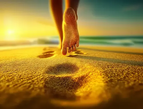 Foot steps on the sandy beach
