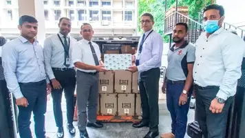 Employees of Sunshine holdings donating health care items